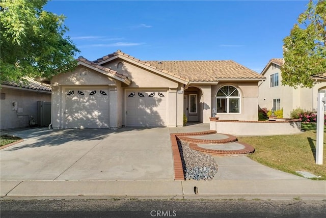 1548 Crystal Downs St, Banning, CA 92220 - view of front facade with a garage, stucco siding, concrete driveway, a tile roof, and a front yard