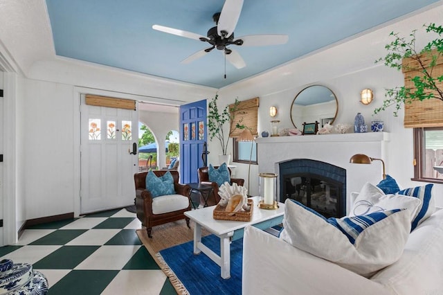 1008 S Ditmar St, Oceanside, CA 92054 - living area with tile patterned floors, healthy amount of natural light, a ceiling fan, and a glass covered fireplace