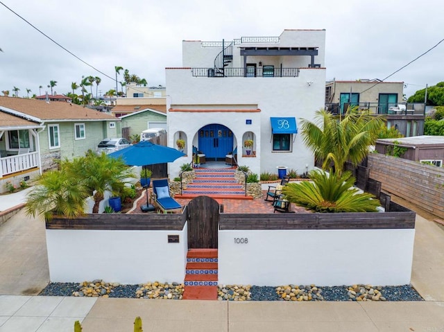1008 S Ditmar St, Oceanside, CA 92054 - view of front facade with a fenced front yard, a gate, and stucco siding