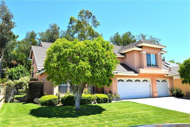 29058 Rosewood Ln, Highland, CA 92346 - view of front of home with a tile roof, stucco siding, a garage, and driveway