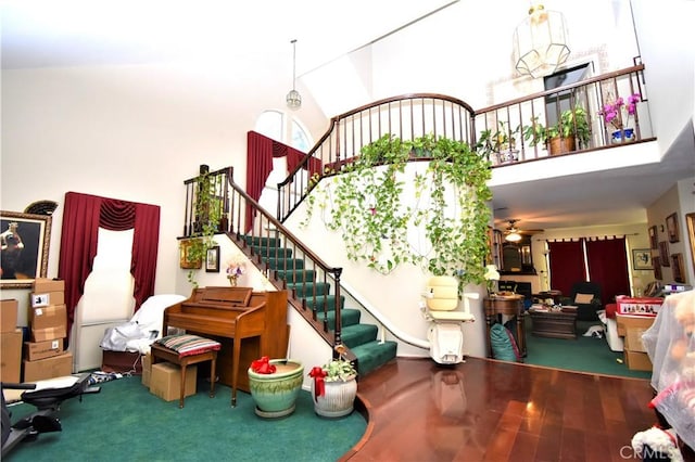 29058 Rosewood Ln, Highland, CA 92346 - stairs with a high ceiling, ceiling fan, and wood finished floors