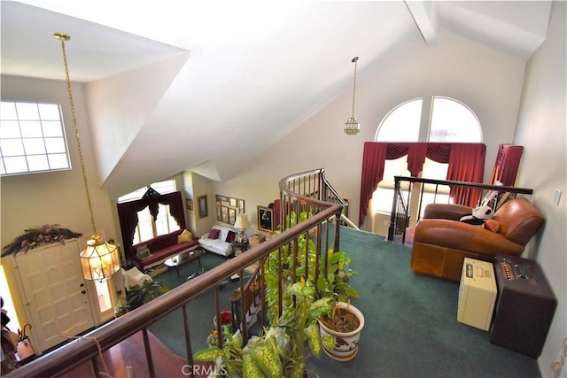 29058 Rosewood Ln, Highland, CA 92346 - sitting room with carpet floors, healthy amount of natural light, beam ceiling, and high vaulted ceiling