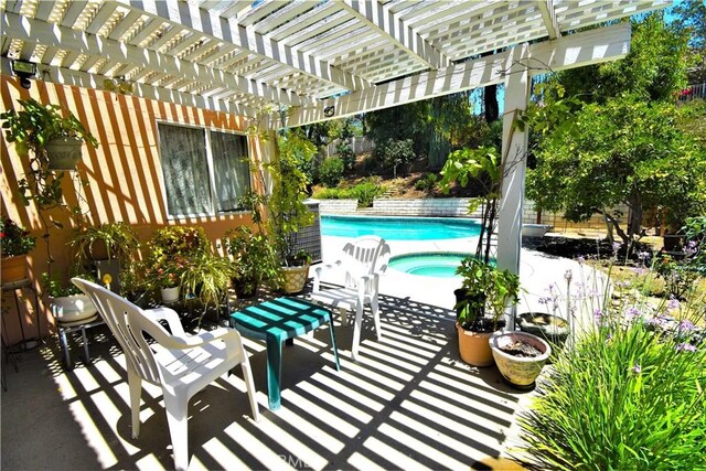 29058 Rosewood Ln, Highland, CA 92346 - fenced backyard featuring an in-ground hot tub, an outdoor pool, a pergola, and a patio