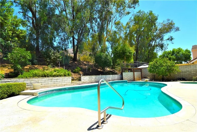 29058 Rosewood Ln, Highland, CA 92346 - view of swimming pool featuring a fenced backyard and a patio