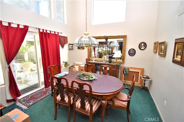 29058 Rosewood Ln, Highland, CA 92346 - carpeted dining space featuring a high ceiling, plenty of natural light, and baseboards