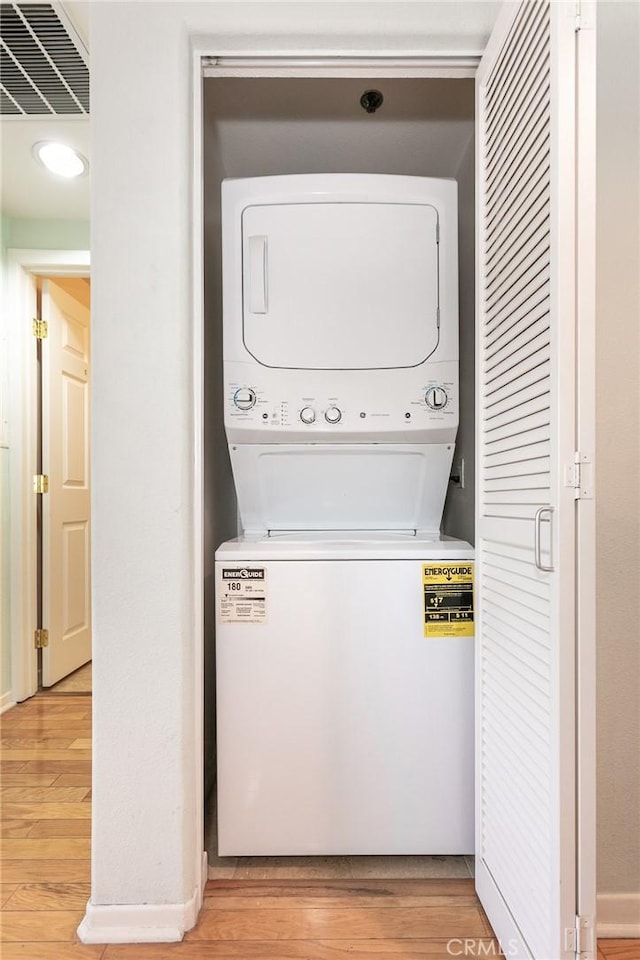 580 W Main St Unit 323, Alhambra, CA 91801 - laundry area with stacked washer and clothes dryer and light wood-style flooring