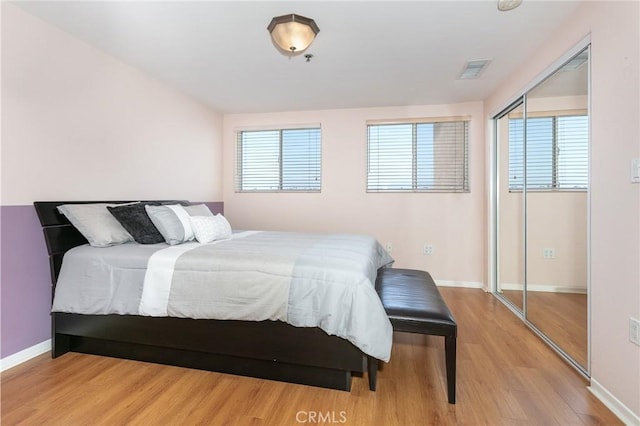 580 W Main St Unit 323, Alhambra, CA 91801 - bedroom featuring wood finished floors, baseboards, and a closet