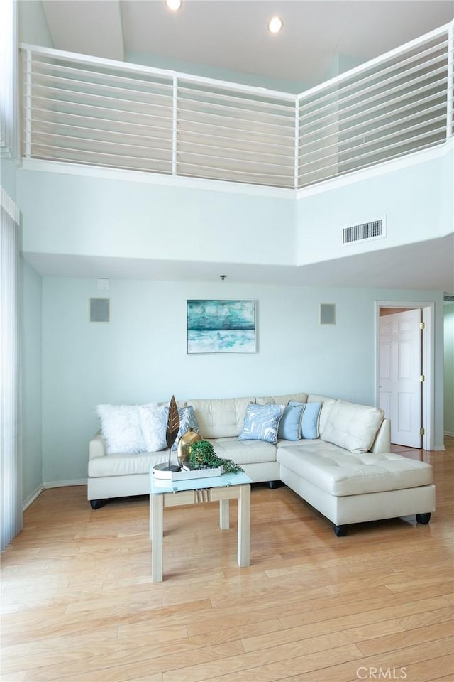 580 W Main St Unit 323, Alhambra, CA 91801 - living area with a high ceiling, baseboards, light wood-style floors, and recessed lighting