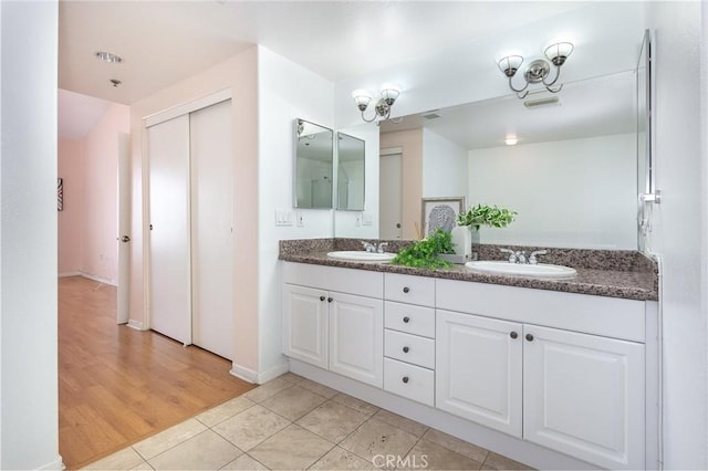 580 W Main St Unit 323, Alhambra, CA 91801 - full bathroom with double vanity, tile patterned floors, and baseboards