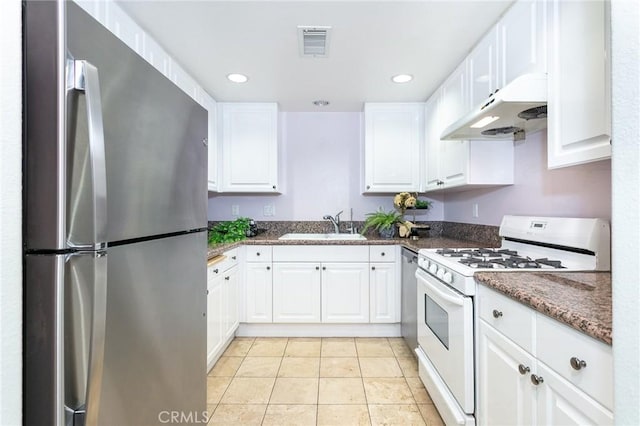 580 W Main St Unit 323, Alhambra, CA 91801 - kitchen featuring appliances with stainless steel finishes, under cabinet range hood, a sink, white cabinetry, and light tile patterned floors