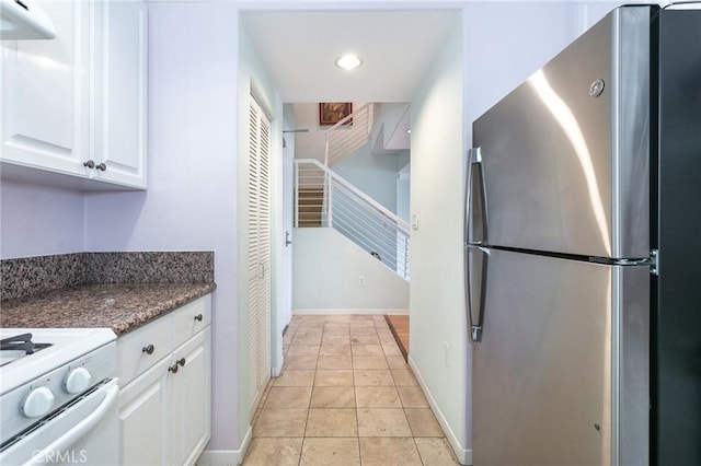 580 W Main St Unit 323, Alhambra, CA 91801 - kitchen with freestanding refrigerator, white cabinetry, recessed lighting, baseboards, and light tile patterned flooring