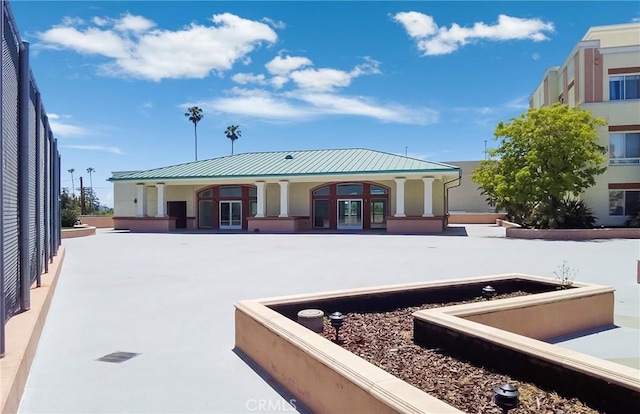 580 W Main St Unit 323, Alhambra, CA 91801 - back of house with french doors, stucco siding, metal roof, and a standing seam roof