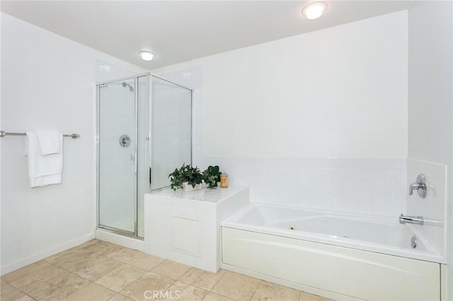 580 W Main St Unit 323, Alhambra, CA 91801 - bathroom with a garden tub, a shower stall, tile patterned flooring, and baseboards