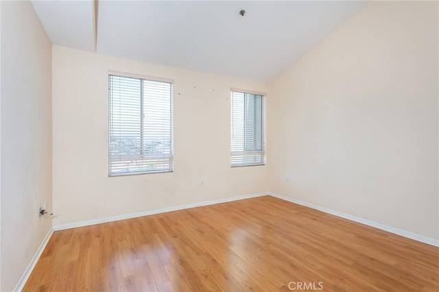 580 W Main St Unit 323, Alhambra, CA 91801 - spare room with healthy amount of natural light, light wood-style flooring, baseboards, and lofted ceiling