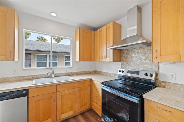 1273 E Appleton St Unit 4, Long Beach, CA 90802 - kitchen with appliances with stainless steel finishes, wall chimney exhaust hood, a sink, light countertops, and decorative backsplash