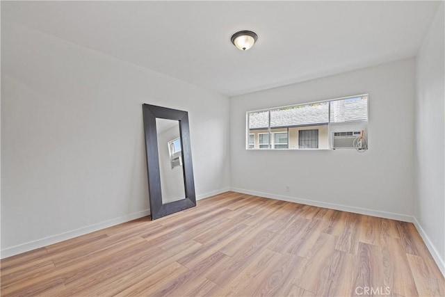 1273 E Appleton St Unit 4, Long Beach, CA 90802 - empty room with cooling unit and light wood finished floors