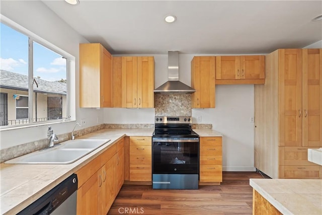1273 E Appleton St Unit 4, Long Beach, CA 90802 - kitchen featuring wall chimney range hood, stainless steel appliances, a sink, dark wood-type flooring, and recessed lighting
