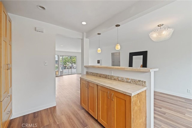 1273 E Appleton St Unit 4, Long Beach, CA 90802 - kitchen with light wood-type flooring, light countertops, decorative light fixtures, baseboards, and recessed lighting