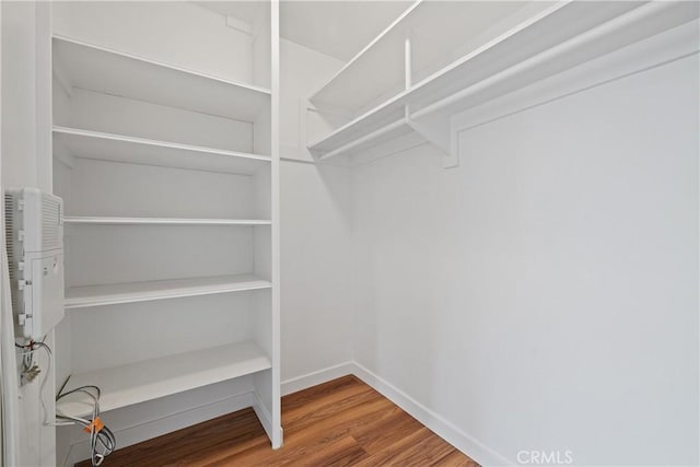 1273 E Appleton St Unit 4, Long Beach, CA 90802 - walk in closet featuring wood finished floors