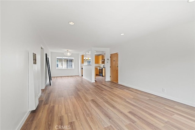 1273 E Appleton St Unit 4, Long Beach, CA 90802 - unfurnished living room featuring a heating unit, light wood-style flooring, baseboards, and recessed lighting