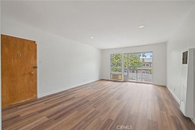 1273 E Appleton St Unit 4, Long Beach, CA 90802 - spare room featuring a heating unit, wood finished floors, baseboards, and recessed lighting