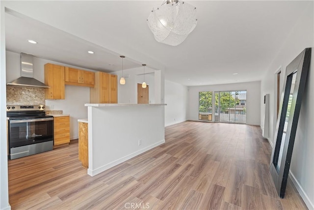 1273 E Appleton St Unit 4, Long Beach, CA 90802 - kitchen with wall chimney range hood, electric stove, open floor plan, light countertops, and light wood finished floors