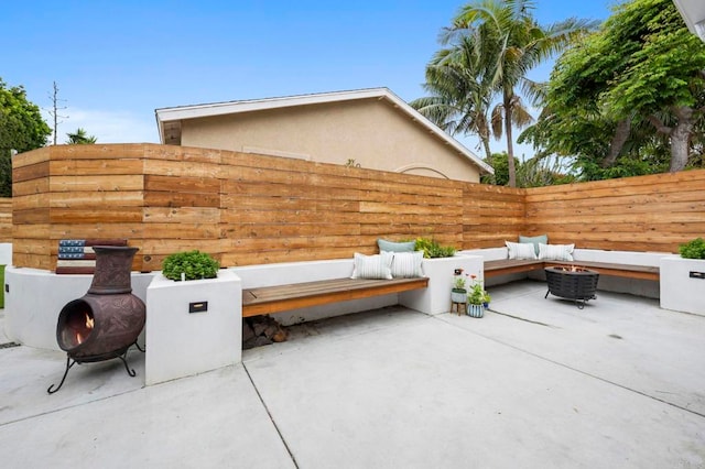 1125 Arcadia Rd, Encinitas, CA 92024 - fenced backyard featuring a fire pit and a patio area