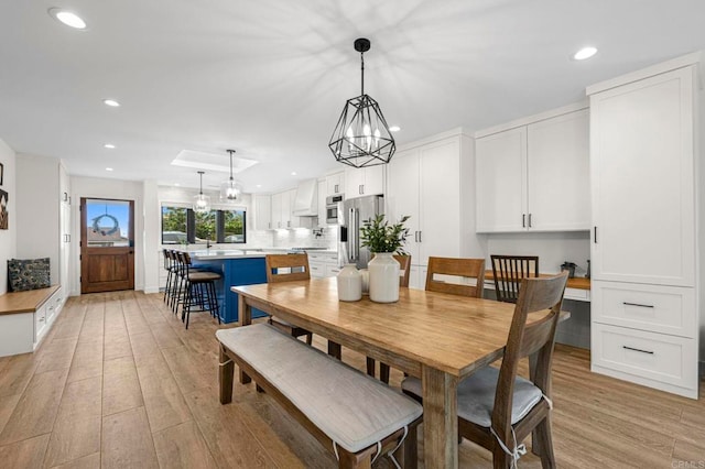 1125 Arcadia Rd, Encinitas, CA 92024 - dining room featuring light wood finished floors, recessed lighting, and a chandelier