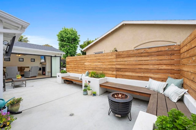 1125 Arcadia Rd, Encinitas, CA 92024 - view of patio / terrace with an outdoor living space with a fire pit
