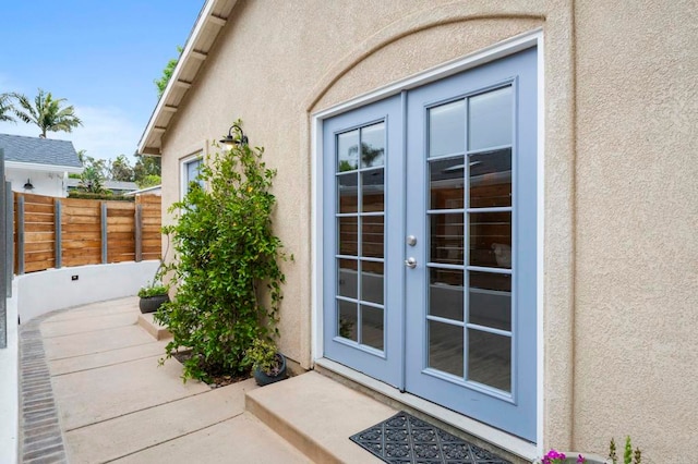 1125 Arcadia Rd, Encinitas, CA 92024 - property entrance featuring french doors and stucco siding