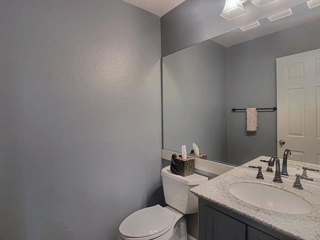 7755 Via Montebello Unit 2, San Diego, CA 92129 - half bath featuring vanity and a textured wall