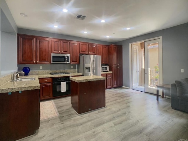 7755 Via Montebello Unit 2, San Diego, CA 92129 - kitchen with stainless steel appliances, light countertops, light wood-type flooring, and recessed lighting