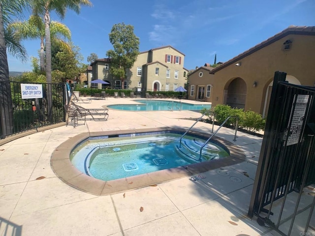 7755 Via Montebello Unit 2, San Diego, CA 92129 - community pool featuring a community hot tub and a patio