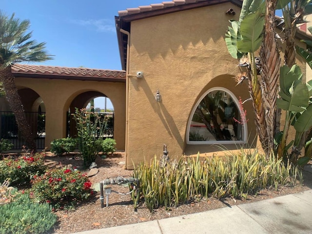 7755 Via Montebello Unit 2, San Diego, CA 92129 - view of property exterior featuring stucco siding and a tile roof
