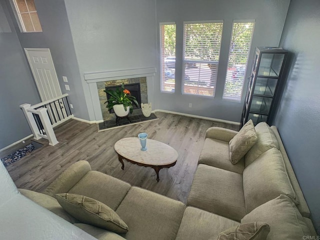 7755 Via Montebello Unit 2, San Diego, CA 92129 - living room featuring wood finished floors and a tile fireplace