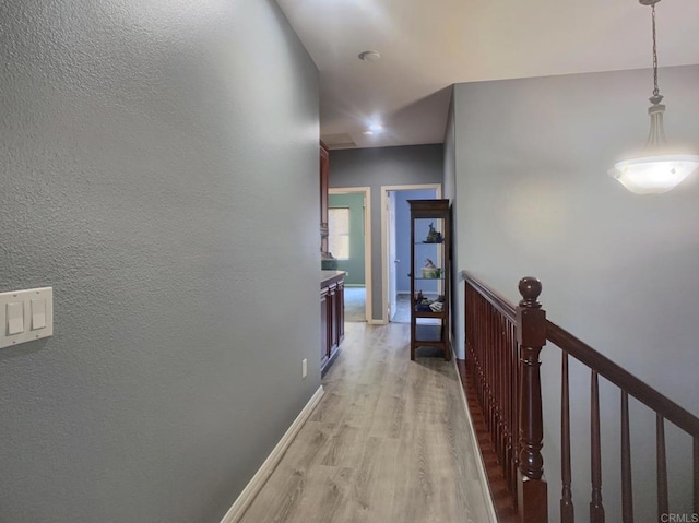 7755 Via Montebello Unit 2, San Diego, CA 92129 - hall featuring light wood-type flooring and an upstairs landing