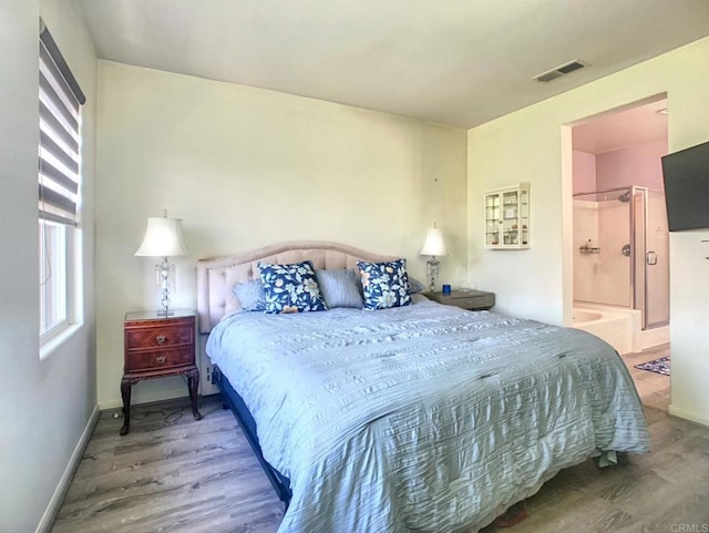 7755 Via Montebello Unit 2, San Diego, CA 92129 - bedroom with wood finished floors and connected bathroom