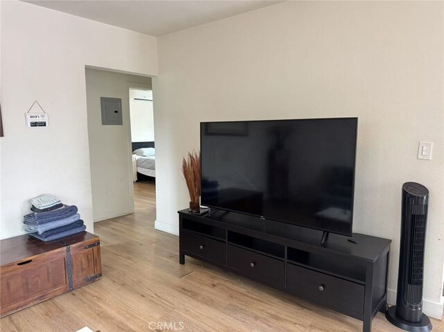 951 E Elma St, Ontario, CA 91764 - living room featuring light wood-type flooring and electric panel