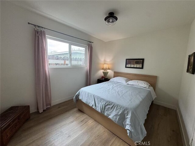 951 E Elma St, Ontario, CA 91764 - bedroom featuring wood finished floors and baseboards