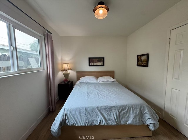 951 E Elma St, Ontario, CA 91764 - bedroom with wood finished floors and baseboards