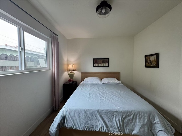 951 E Elma St, Ontario, CA 91764 - bedroom featuring baseboards and dark wood finished floors
