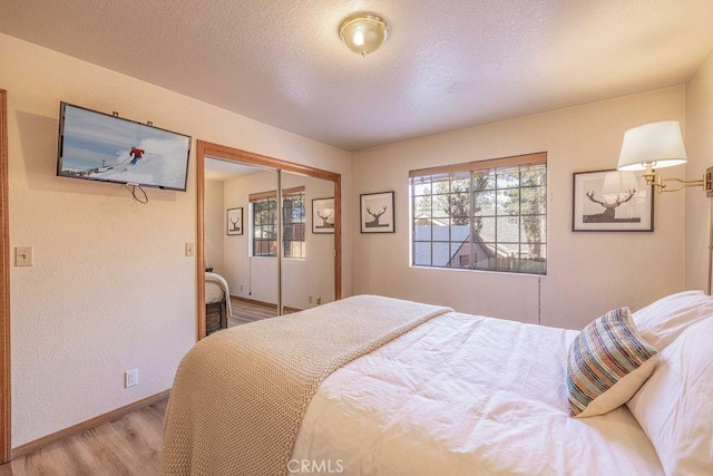 42756 Tannenbaum Platz, Big Bear Lake, CA 92315 - bedroom with wood finished floors, baseboards, and a closet