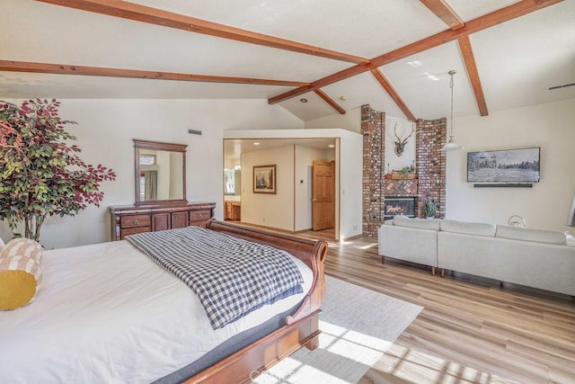 42756 Tannenbaum Platz, Big Bear Lake, CA 92315 - bedroom featuring wood finished floors and a brick fireplace