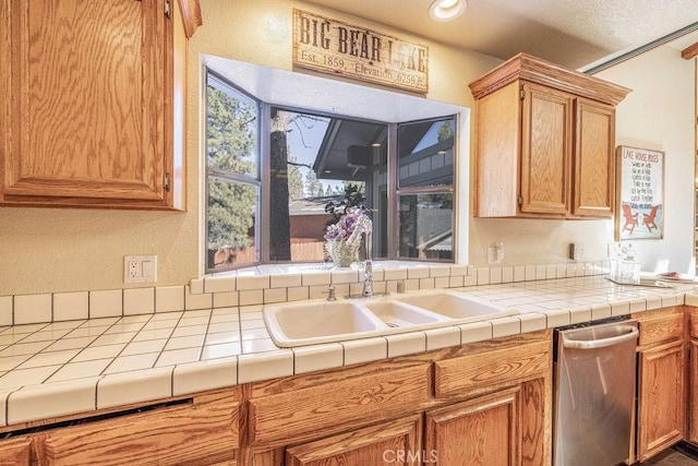 42756 Tannenbaum Platz, Big Bear Lake, CA 92315 - kitchen with a sink, a textured wall, and tile countertops