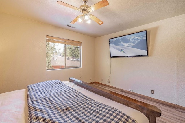 42756 Tannenbaum Platz, Big Bear Lake, CA 92315 - bedroom with wood finished floors, baseboards, and ceiling fan