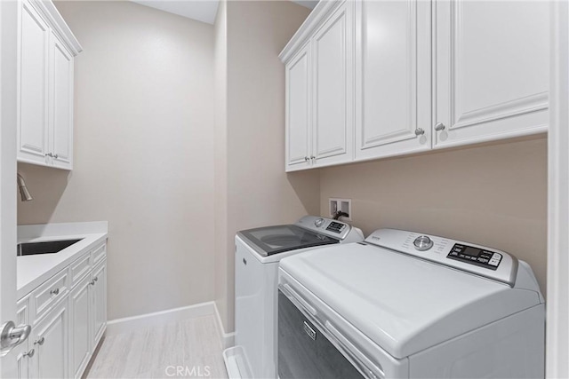 288 Shorey Dr, Glendora, CA 91741 - laundry room featuring washer and dryer, cabinet space, baseboards, and light wood-type flooring