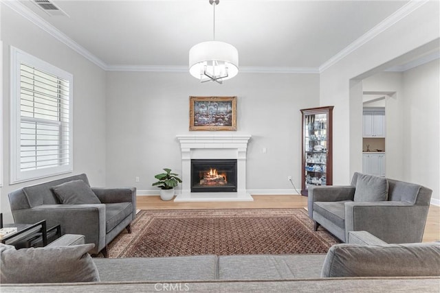 288 Shorey Dr, Glendora, CA 91741 - living area featuring wood finished floors, ornamental molding, a glass covered fireplace, and baseboards