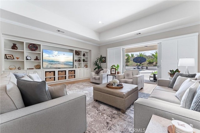 288 Shorey Dr, Glendora, CA 91741 - living area featuring crown molding, built in shelves, a raised ceiling, and light wood finished floors