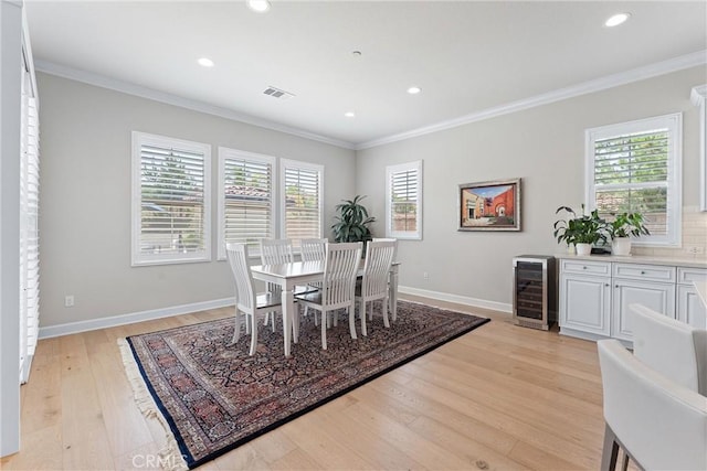 288 Shorey Dr, Glendora, CA 91741 - dining room featuring wine cooler, ornamental molding, healthy amount of natural light, light wood finished floors, and baseboards