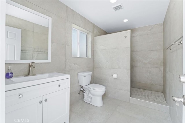 288 Shorey Dr, Glendora, CA 91741 - bathroom with toilet, tile walls, vanity, a walk in shower, and tile patterned floors